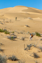People exploring the dunes in the Sonora desert. Gran Desierto de Altar, Sonora Mexico.