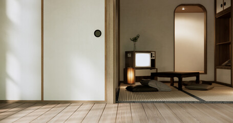 TV on canbinet low table in room Japanese style with lamp.