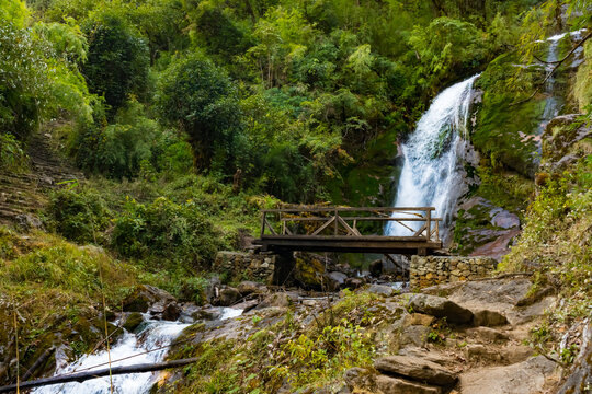 A waterfall with wooden bridge in Thangyam Village of Taplejung, Kanchenjunga Trek, Nepal