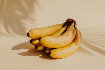 A bunch of ripe yellow bananas sit on top of a wooden table