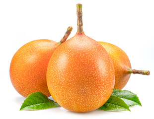 Granadilla fruits with leaves close up. The sweetest passiflora fruit or passionfruit.