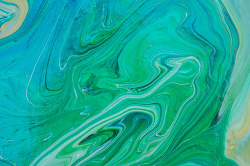 Beautiful fluid art natural luxury painting. Marbleized effect. Ancient oriental drawing technique. Teal, green, blue and turquoise colors. Abstract decorative marble texture. 