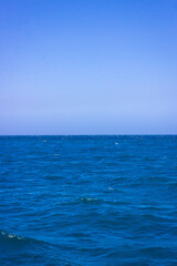 Obraz premium Where the blue sky meets the blue sea, tranquility, sound of calm sea.
