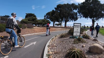 People cycling in the Presidio near the Golden Gate Bridge in San Francisco - Powered by Adobe