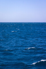 Naklejka premium Where the blue sky meets the blue sea, tranquility, sound of calm sea.