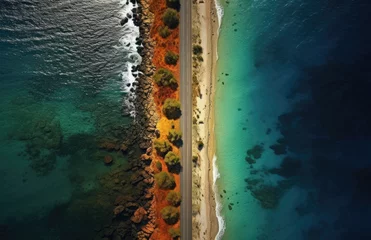 Fototapeten Aerial view of the road along the coast from the drone. Travel by car in summer time. The sea coast and the road.  © ribelco