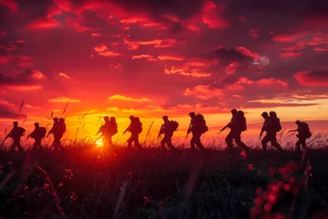 Fototapeten Sunset March of Military Troop in Silhouette. © Poter
