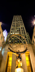 Atlas, a bronze statue in Rockefeller Center, Midtown Manhattan. It is across on Fifth Avenue in St. Patrick\'s Cathedral. Sculptor Lee Lawrie and was installed in 1937.