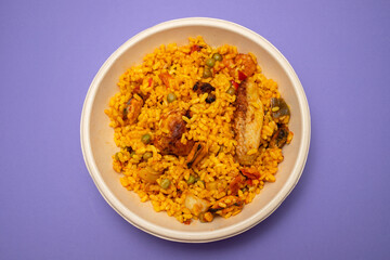 typicla spanish dish paella in plastic plate