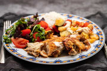 grilled chicken with salad and boiled rice in plate