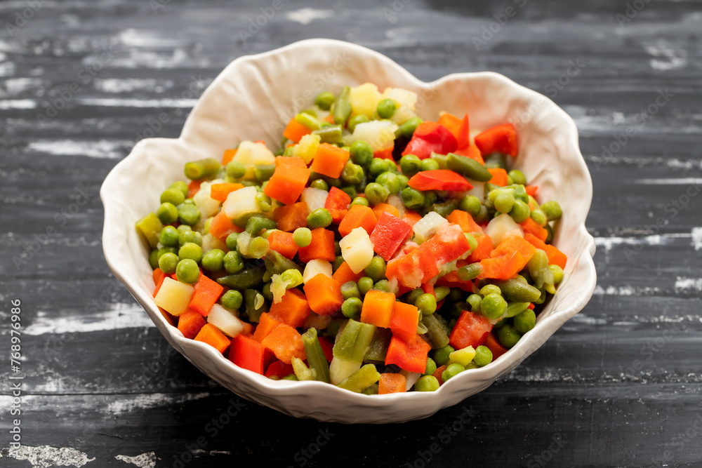 Wall mural mix of fresh vegetables in white bowl, top view