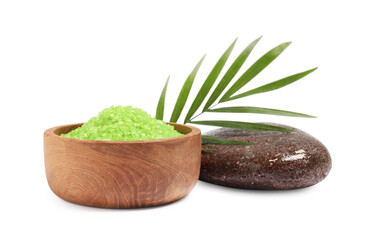 Green sea salt in bowl, palm leaf and spa stone isolated on white