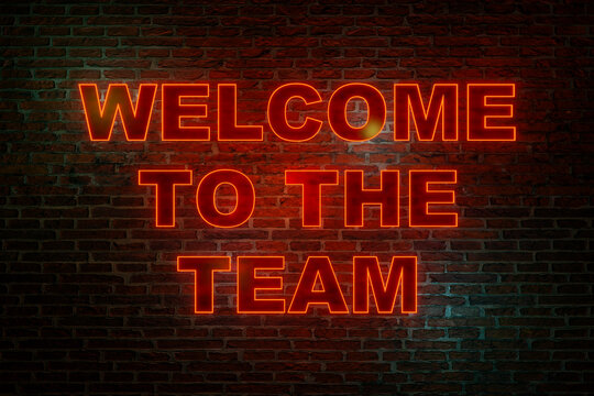 Welcome to the team. Brick wall at night with the text "Welcome to the team" in orange neon letters. Greeting and motivation. 3D illustration