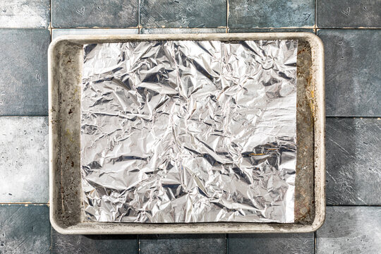 Overhead of tin foil on baking sheet