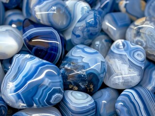 A collection of blue and white marbles piled on top of each other, creating a visually striking pattern
