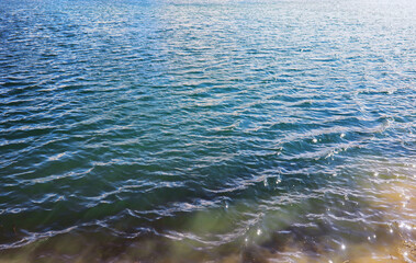 Water surface. The texture of the water. Waves on the lake in windy weather.