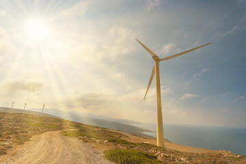 Obraz premium Wind turbines on beautiful sunny mountain landsape. Green power generation concept.