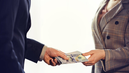 Woman Hand taking cash paper money from man hand.Banknote exchange.Paying woman for service or...