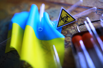 Ukrainian flag biohazard and test tubes. Assistance to Ukraine in biolaboratories. Western biological laboratories in Ukraine. - 768996945