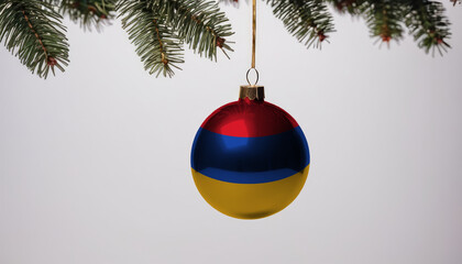 New Year's ball with the flag of Armenia on a Christmas tree branch isolated on white background. Christmas and New Year concept.