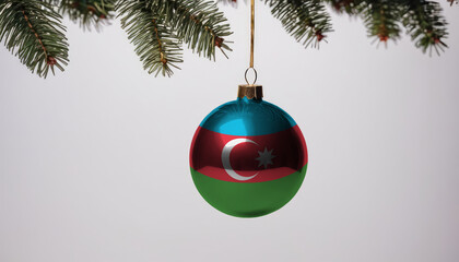 New Year's ball with the flag of Azerbaijan on a Christmas tree branch isolated on white background. Christmas and New Year concept.