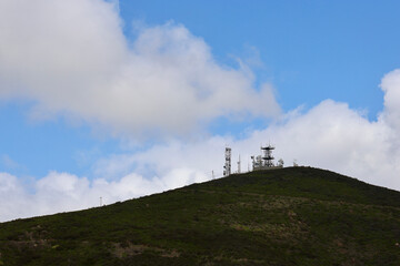 Fototapeta na wymiar communication satellites and antenna on a countryside hilltop