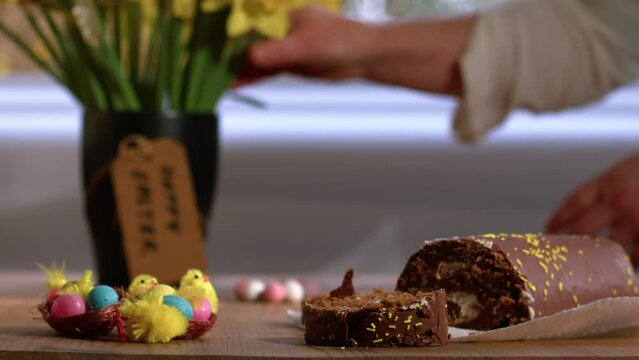 Celebrating Easter chocolate cake s and daffodil flowers display