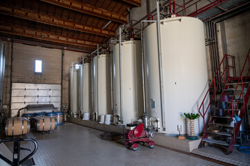Steel tanks for first fermentation of grapes, Saint-Emilion wine making region picking, sorting...