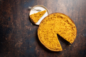 Dutch 'Kruimelvlaai' on a old rustic wooden table. Top view of a dutch pie. 
