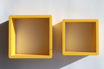 yellow frames with shadow on wall with 3d effect