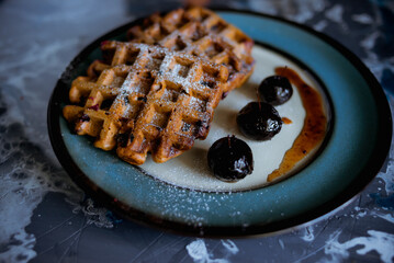 Young woman with laptop walking outdoors in business district
