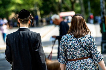 Orthodox Jews in Central Park which is a public urban park located in the metropolitan district of Manhattan, in the Big Apple in New York City (USA).
