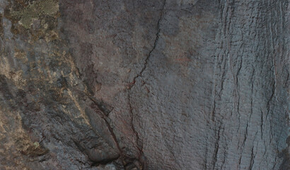 Stone background with cracked pattern and yellow area