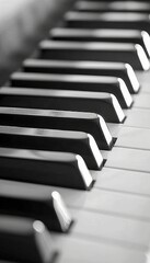 Detailed close up of black and white piano keyboard in monochrome for focused view