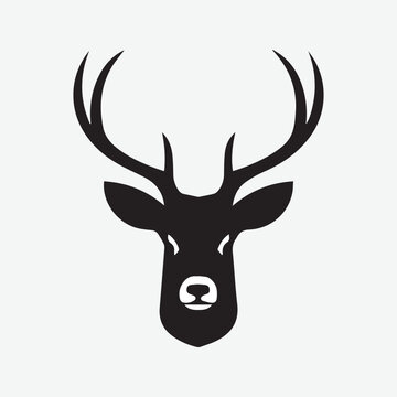 Black vector silhouette of a deer head with antlers isolated on a white background