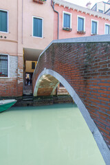 Obraz na płótnie Canvas Typical footpath bridge over canal in Venice, Veneto, Italy