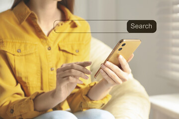 Search bar of website over smartphone. Woman using device indoors, closeup