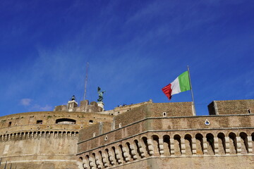 An Italian flag flying over the Castel Sant' Angelo fortress, former mausoleum of Roman Emperor...
