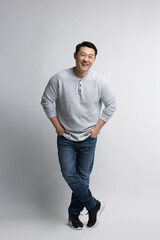 Full length portrait of happy man on light background