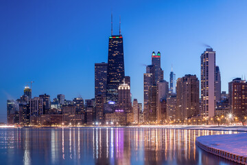 Chicago, Illinois, USA downtown skyline from Lake Michigan at dusk.