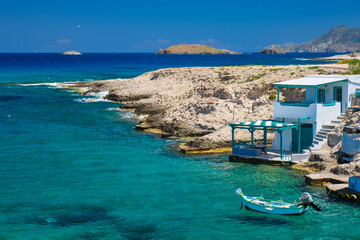 Crystal clear blue water at MItakas village beach, Milos island, Greece. - obrazy, fototapety, plakaty