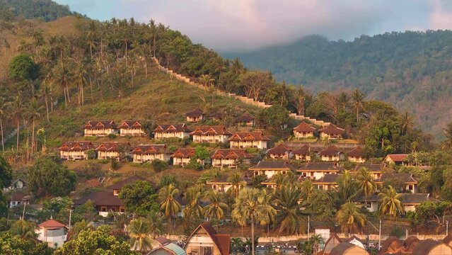 Lombok island, Indonesia. Aerial 4K footage of Senggigi resort coastline in West Nusa Tenggara, Indonesia. Resort island in east from Bali island. Drone video