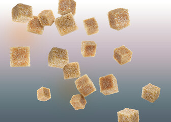 Brown cane sugar cubes falling on color gradient background