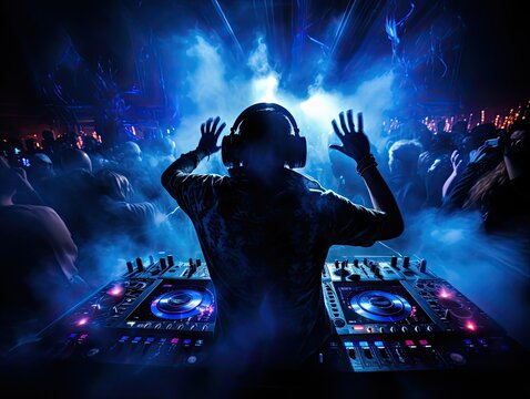 Under the blue light, a DJ works their magic, fingers tapping and hands moving in rhythm. Their focus is intense, lost in the beats of the music. 