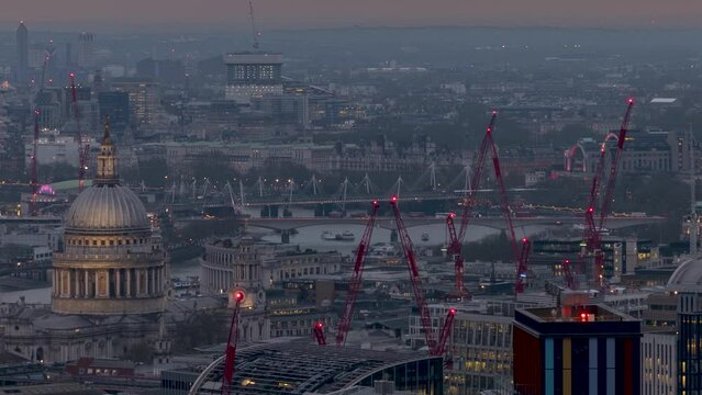 Sunset to night time lapse view of the central London skyline with St. Pauls Cathedral and Waterloo Bridge in the Background