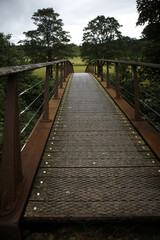 Obraz premium Footbridge over River Irthing - Along the Hadrian's wall between Birdoswald fort and Gilsland - Cumbria - Northumberland - England - UK