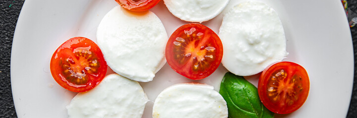 mozzarella salad caprese tomato, basil fresh food tasty eating appetizer meal food snack on the...