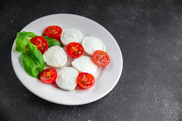 mozzarella salad caprese tomato, basil fresh food tasty eating appetizer meal food snack on the table copy space food background 