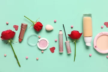 Poster Cosmetic products with red roses on turquoise background. Valentine's day celebration © Pixel-Shot