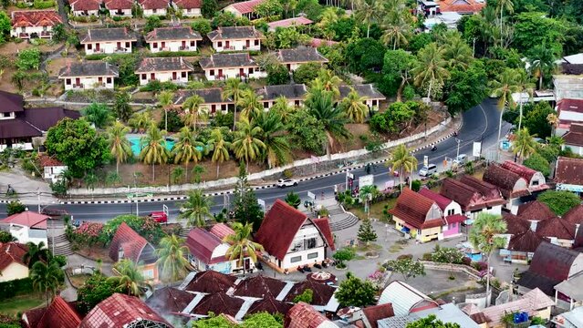 Lombok island, Indonesia. Aerial 4K footage of Senggigi resort city life in West Nusa Tenggara, Indonesia. Resort island in east from Bali island. Drone video